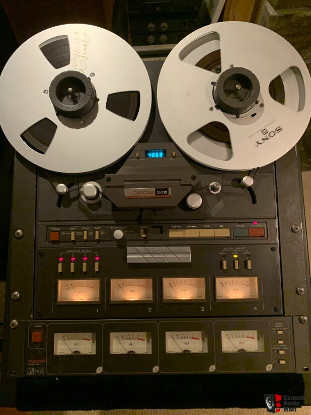 https://img.canuckaudiomart.com/uploads/large/2900017-18f87f5c-tascam-34-four-track-professional-reel-to-reel-recorder-package-remote-meter-unit-stand.jpg