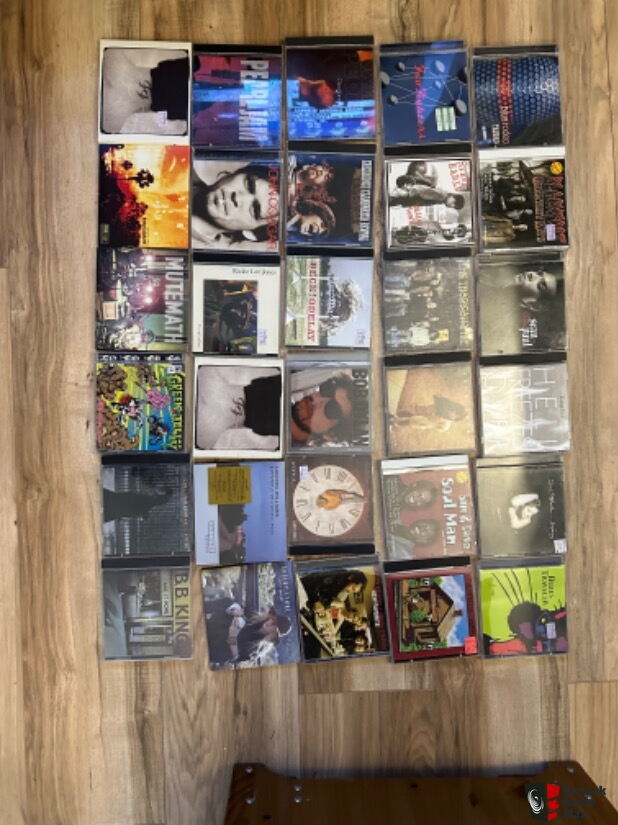 300 cd's of various genre with cd rack